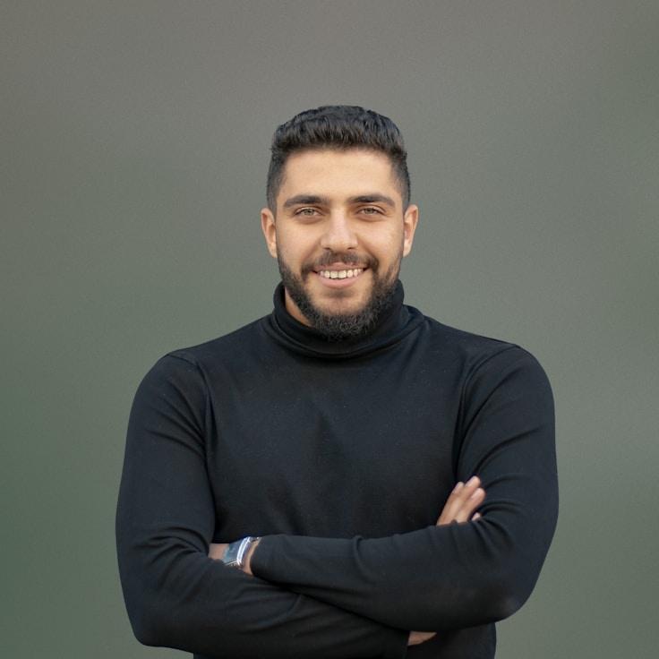 Kaveri Mehta, Lead Design Curator at GreenLeafStudio, reviewing corporate floral arrangements